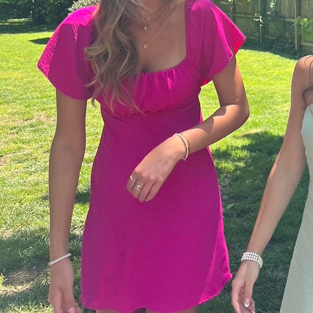 Pink open back bow tie dress